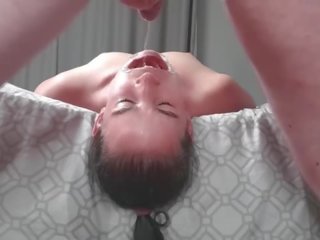 Upside down piss loving slut laying face down from bed swallows piss in two non identical camera angles